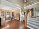 Elegant living room featuring hardwood floors, staircase, and bright natural light at 3595 Millwater Xing, Dacula, GA 30019