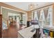 Bright office space with large windows, wood floors, and elegant decor, perfect for working from home at 3595 Millwater Xing, Dacula, GA 30019