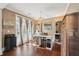 Bright home office with hardwood floors, built-in cabinets, and natural light at 3595 Millwater Xing, Dacula, GA 30019