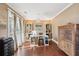 Bright home office with hardwood floors, built-in cabinets, and natural light at 3595 Millwater Xing, Dacula, GA 30019