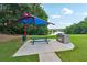 Lush picnic area with a built-in grill, perfect for outdoor dining and entertaining at 3595 Millwater Xing, Dacula, GA 30019