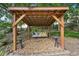 Outdoor wooden swing set with a comfortable cushioned swing, perfect for relaxing and enjoying the backyard at 3595 Millwater Xing, Dacula, GA 30019