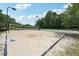 A well-maintained sand volleyball court provides a fun recreational amenity at 3595 Millwater Xing, Dacula, GA 30019
