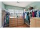 Walk-in closet with natural light and built-in shelving providing ample storage at 3595 Millwater Xing, Dacula, GA 30019