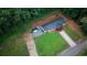 An aerial view showing the home's layout, generous lot size, shed, and new concrete driveway at 4670 Brookwood Dr, Cumming, GA 30041