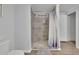 Bathroom with a tiled walk-in shower and modern fixtures at 4670 Brookwood Dr, Cumming, GA 30041