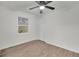 A bright bedroom featuring light, hard surface floors, a ceiling fan, and a window at 4670 Brookwood Dr, Cumming, GA 30041