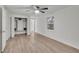 Bright bedroom with closet, window, wood-look floors and ceiling fan at 4670 Brookwood Dr, Cumming, GA 30041