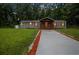 Charming home with a covered front porch, a well manicured lawn, and a concrete driveway at 4670 Brookwood Dr, Cumming, GA 30041