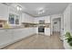 Bright, modern kitchen with white cabinets, stainless steel appliances, and a stylish backsplash at 4670 Brookwood Dr, Cumming, GA 30041