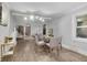 Spacious living room with dining area, showcasing natural light and an open floor plan, hardwood floors at 4670 Brookwood Dr, Cumming, GA 30041