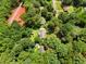 Overhead shot of a house amidst mature trees, showcasing its secluded and natural setting at 501 Samaritan Dr, Cumming, GA 30040