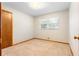 Bedroom with a window, carpet, and closet, offering a cozy and functional layout at 501 Samaritan Dr, Cumming, GA 30040