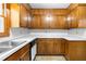 Functional kitchen with white countertops and wood cabinets at 501 Samaritan Dr, Cumming, GA 30040