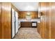 Well-lit kitchen featuring classic wood cabinets and standard appliances at 501 Samaritan Dr, Cumming, GA 30040