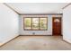Bright living room with large windows and a wooden door at 501 Samaritan Dr, Cumming, GA 30040