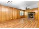 Bright living room with a stone fireplace, ceiling fan, and hardwood floors at 501 Samaritan Dr, Cumming, GA 30040