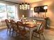 A dining room featuring a chandelier, a table set for six, and a decorative console table at 747 Dogwood Cir, Norcross, GA 30071