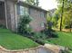 Brick home with a beautifully landscaped front yard and a stone paver walkway with lighting at 747 Dogwood Cir, Norcross, GA 30071