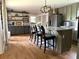 Modern kitchen with island seating, stainless appliances, and gray cabinetry at 747 Dogwood Cir, Norcross, GA 30071