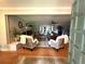 Open living room featuring hardwood floors and fireplace at 747 Dogwood Cir, Norcross, GA 30071