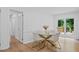 Bright dining room with hardwood floors, modern furnishings, and access to the outdoor deck at 2238 Pinecliff Ne Dr, Atlanta, GA 30345