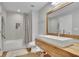 Modern bathroom with a soaking tub, tiled shower, and wooden vanity with a rectangular sink at 4520 Odum Lake Trl, Cumming, GA 30040