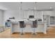 Stylish kitchen island with granite countertops and bar seating, complemented by stainless steel appliances at 4520 Odum Lake Trl, Cumming, GA 30040