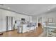 Bright kitchen featuring stainless steel appliances, a breakfast bar, and an adjacent dining area at 4520 Odum Lake Trl, Cumming, GA 30040