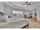 Airy main bedroom featuring trey ceilings, natural light and an attached exercise space for convenience at 4520 Odum Lake Trl, Cumming, GA 30040