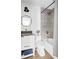 Well-lit bathroom with gray tiles, modern fixtures, and a stylish vanity at 2086 Harold Se Ave, Smyrna, GA 30080