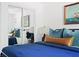Bedroom view showing a comfortable bed, nautical decor, and a mirrored closet providing a roomy feel at 2086 Harold Se Ave, Smyrna, GA 30080