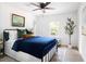 A cozy bedroom features an iron bed frame, a ceiling fan and lots of natural light at 2086 Harold Se Ave, Smyrna, GA 30080