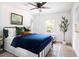 Airy bedroom with a ceiling fan, area rug, tree accent, and window with a view at 2086 Harold Se Ave, Smyrna, GA 30080