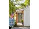 Charming front entrance with a wooden pillar, light green door, and American flag at 2086 Harold Se Ave, Smyrna, GA 30080