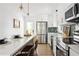 Bright kitchen boasts stainless appliances, white cabinetry, and an island with seating, creating a functional and stylish design at 2086 Harold Se Ave, Smyrna, GA 30080