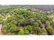 Aerial view of property at 3156 Laurel Way, Snellville, GA, surrounded by mature trees, as outlined in blue at 3156 Laurel Way, Snellville, GA 30078