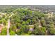 Aerial view of property surrounded by mature trees, as outlined in blue at 3156 Laurel Way, Snellville, GA 30078
