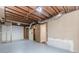Unfinished basement with exposed ceiling, door to another room, and utility hookups at 3156 Laurel Way, Snellville, GA 30078