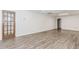 Spacious finished basement with wood-look floors and convenient access door at 3156 Laurel Way, Snellville, GA 30078