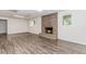 Basement with a brick fireplace and hearth, wood-look floors, and natural light at 3156 Laurel Way, Snellville, GA 30078