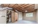 Unfinished basement with door to additional room, utility hook ups, and window at 3156 Laurel Way, Snellville, GA 30078