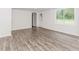 The finished basement features sleek floors, window and door to the outside, ready for your personal touch at 3156 Laurel Way, Snellville, GA 30078