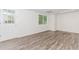 This finished basement features sleek floors, window, and door to the outside, ready for your personal touch at 3156 Laurel Way, Snellville, GA 30078