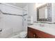 Updated bathroom showcasing subway tile shower with bench and a decorative mirror at 3156 Laurel Way, Snellville, GA 30078