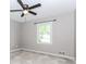 Bedroom featuring neutral carpeting, window and a ceiling fan at 3156 Laurel Way, Snellville, GA 30078