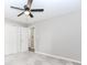 Bedroom with closet space and ceiling fan, featuring plush carpeting at 3156 Laurel Way, Snellville, GA 30078