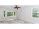 Spacious bedroom with bay window overlooking a treed area, ceiling fan and carpeting at 3156 Laurel Way, Snellville, GA 30078