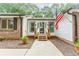 Close-up of the home's entrance, highlighting the front porch, and well-manicured landscaping details at 3156 Laurel Way, Snellville, GA 30078