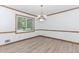 Bright living room with large window and modern chandelier at 3156 Laurel Way, Snellville, GA 30078